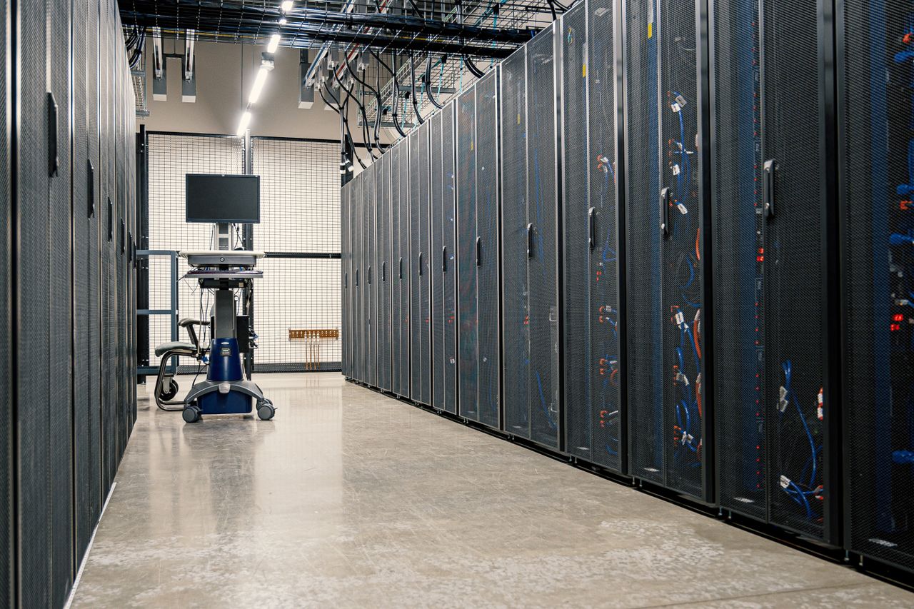 gallery-02 Steel framework cabinets housing servers networking devices and cables in contemporary equipped data center