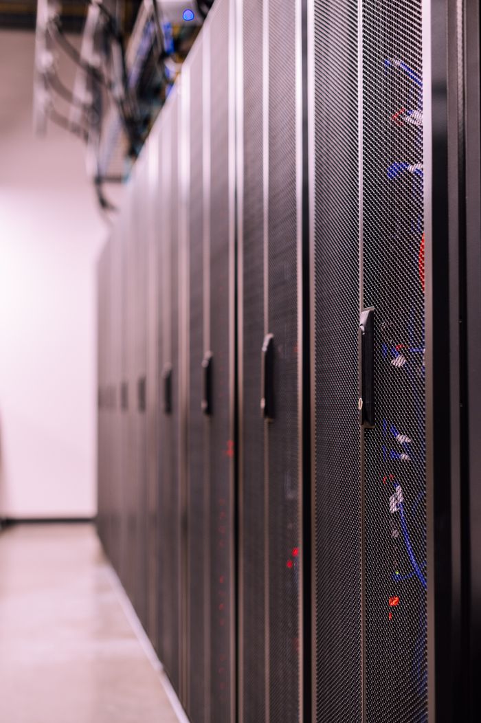 journey-01 Row of similar lockers with various optic fiber cables in modern data server room